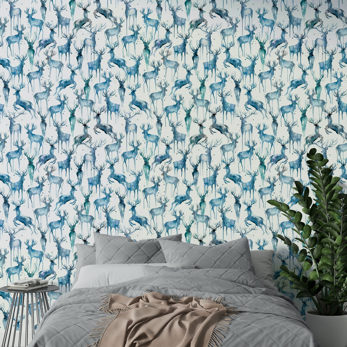 Deer in a winter scene on blue wallpaper design