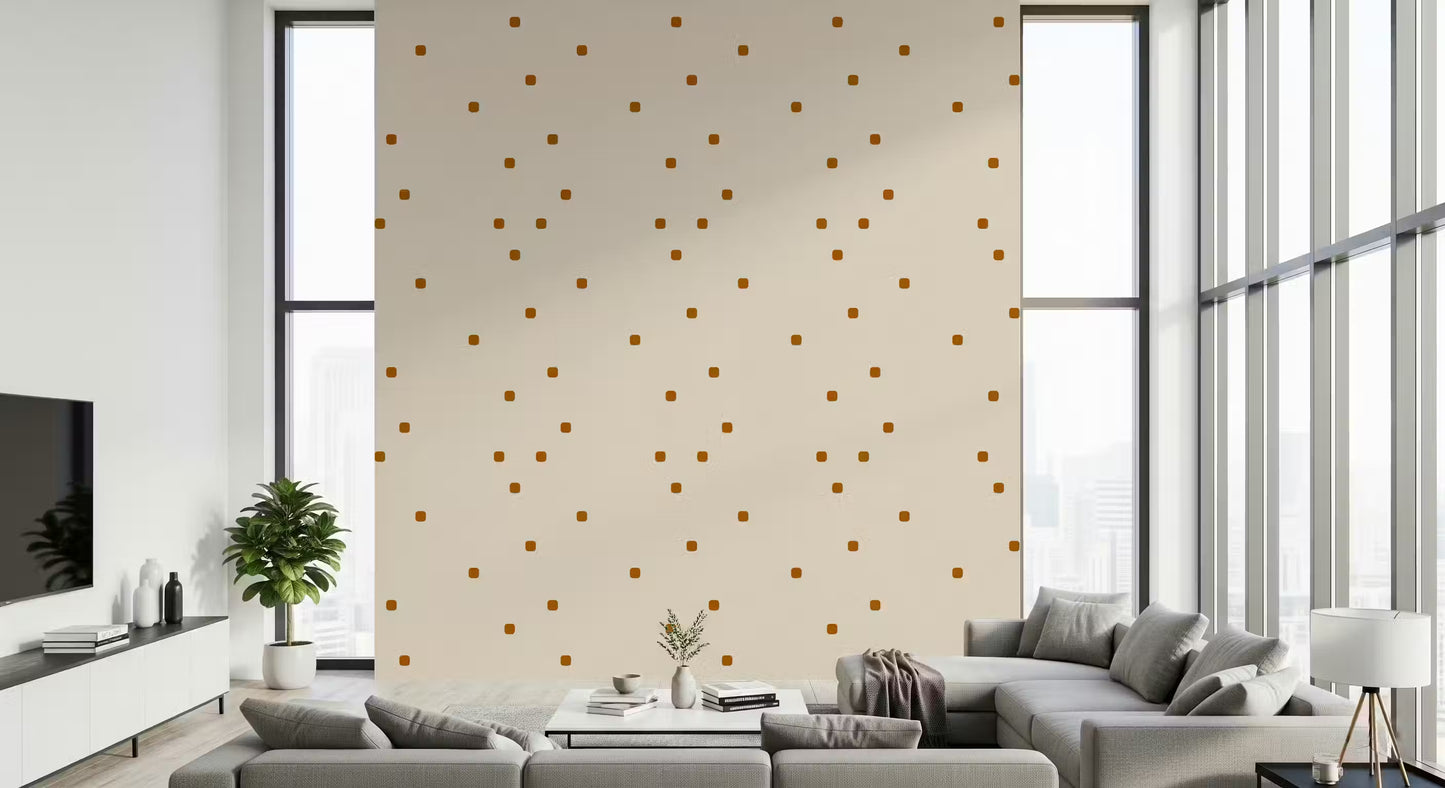 Scattered square dot pattern in caramel brown on a soft beige wallpaper.