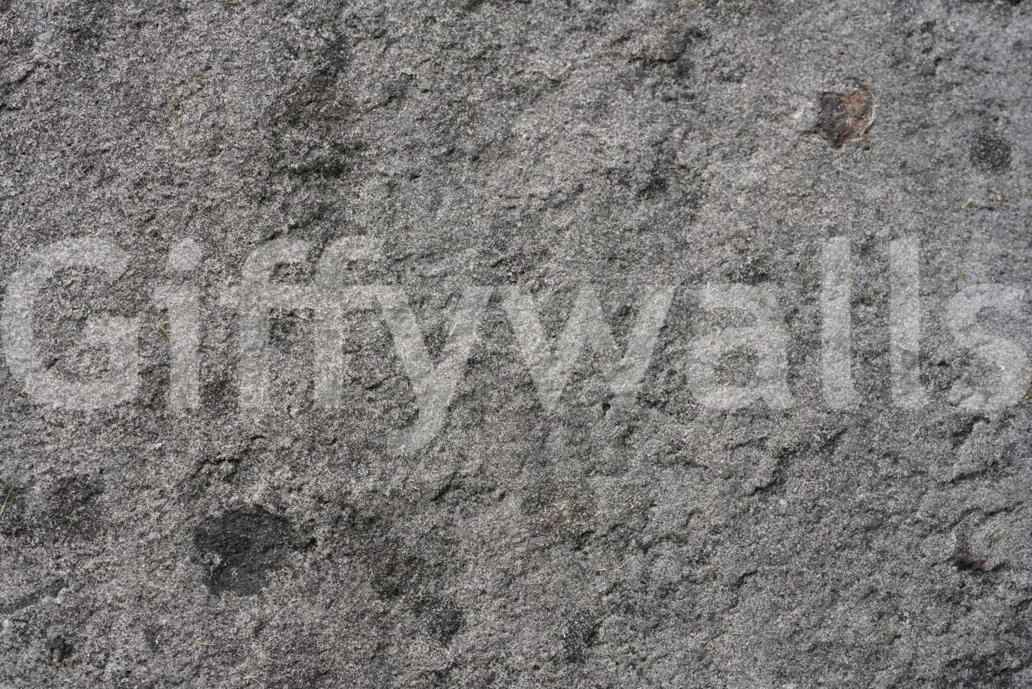 Corner view of gray peel and stick feature wall.