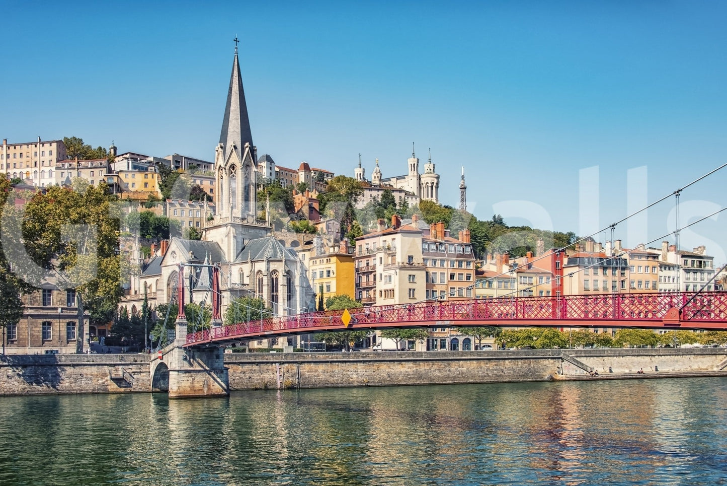 Urban landscape of Lyon with a red bridge.