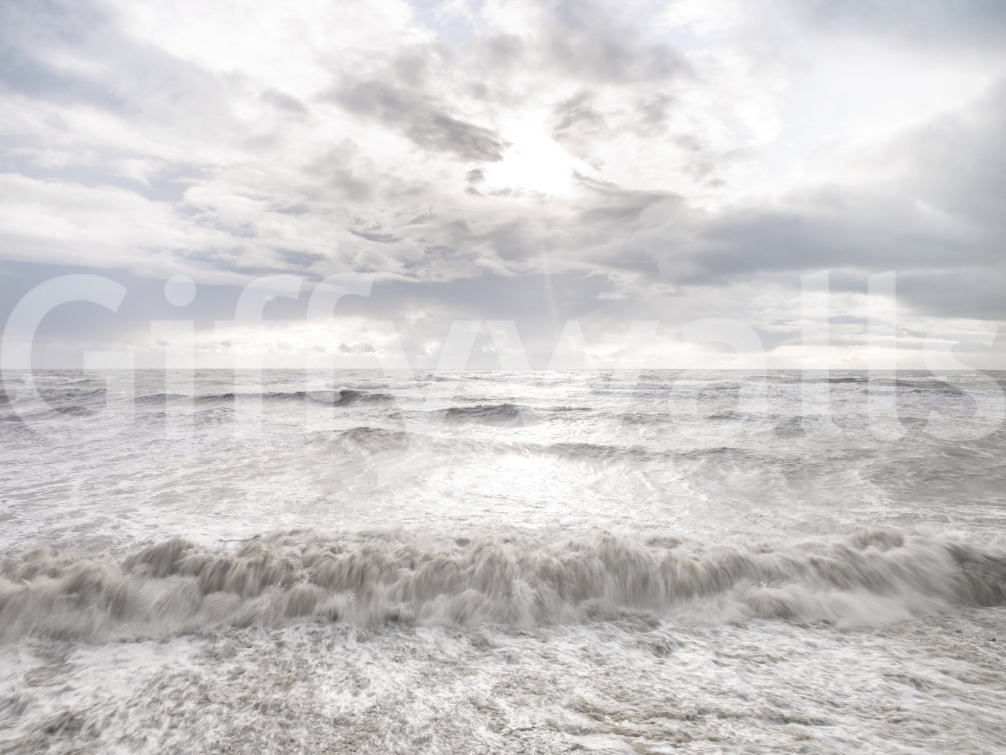 Wide ocean view in Rough Stormy Sea Wall Mural showing turbulent surf motion
