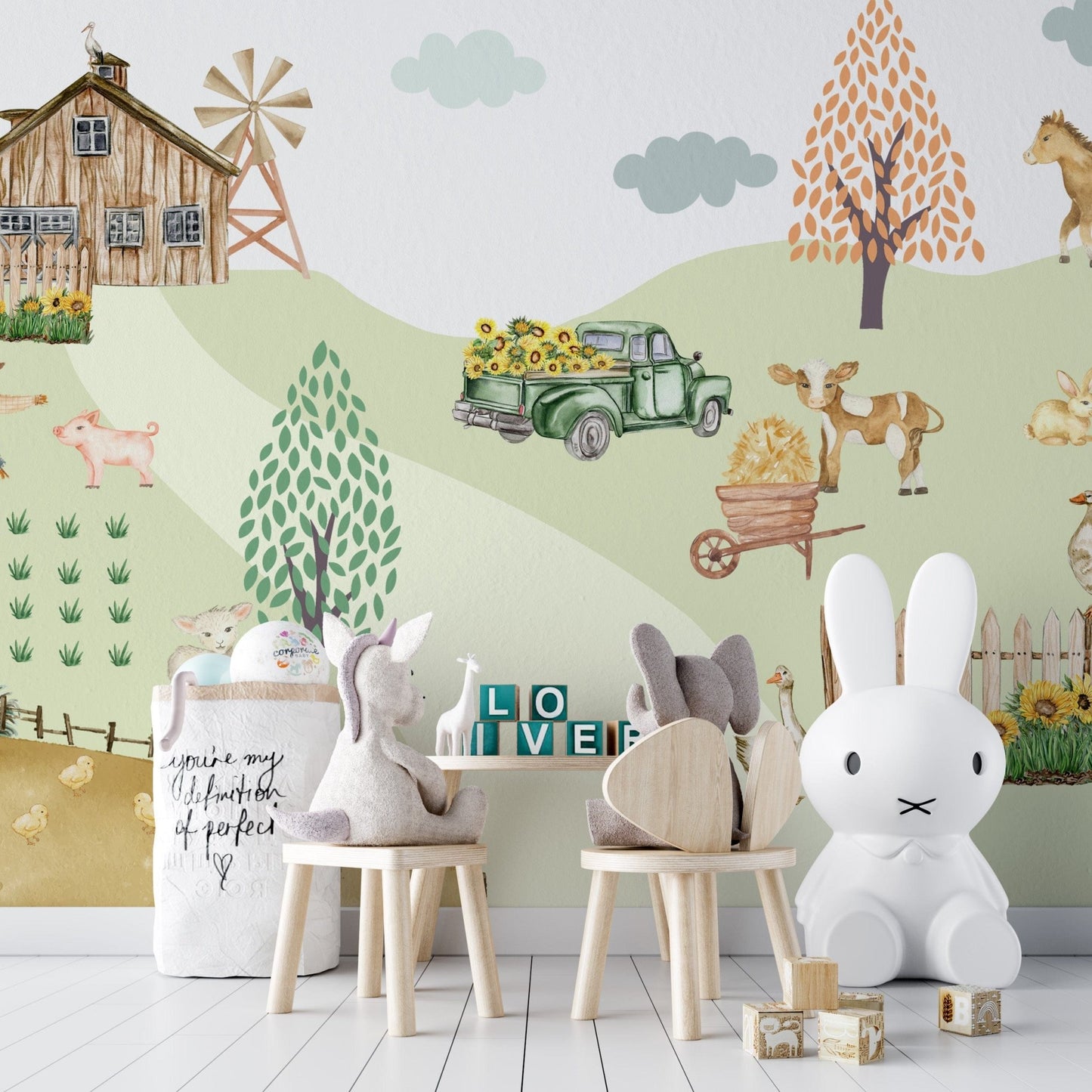 Scarecrow and pig beside rows of crops