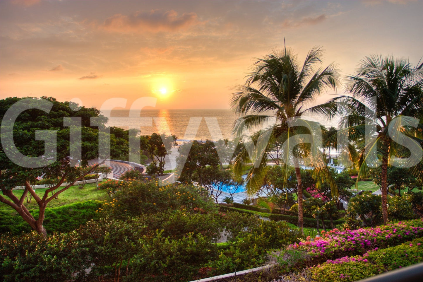 Sunset over ocean mural with Hawaiian theme