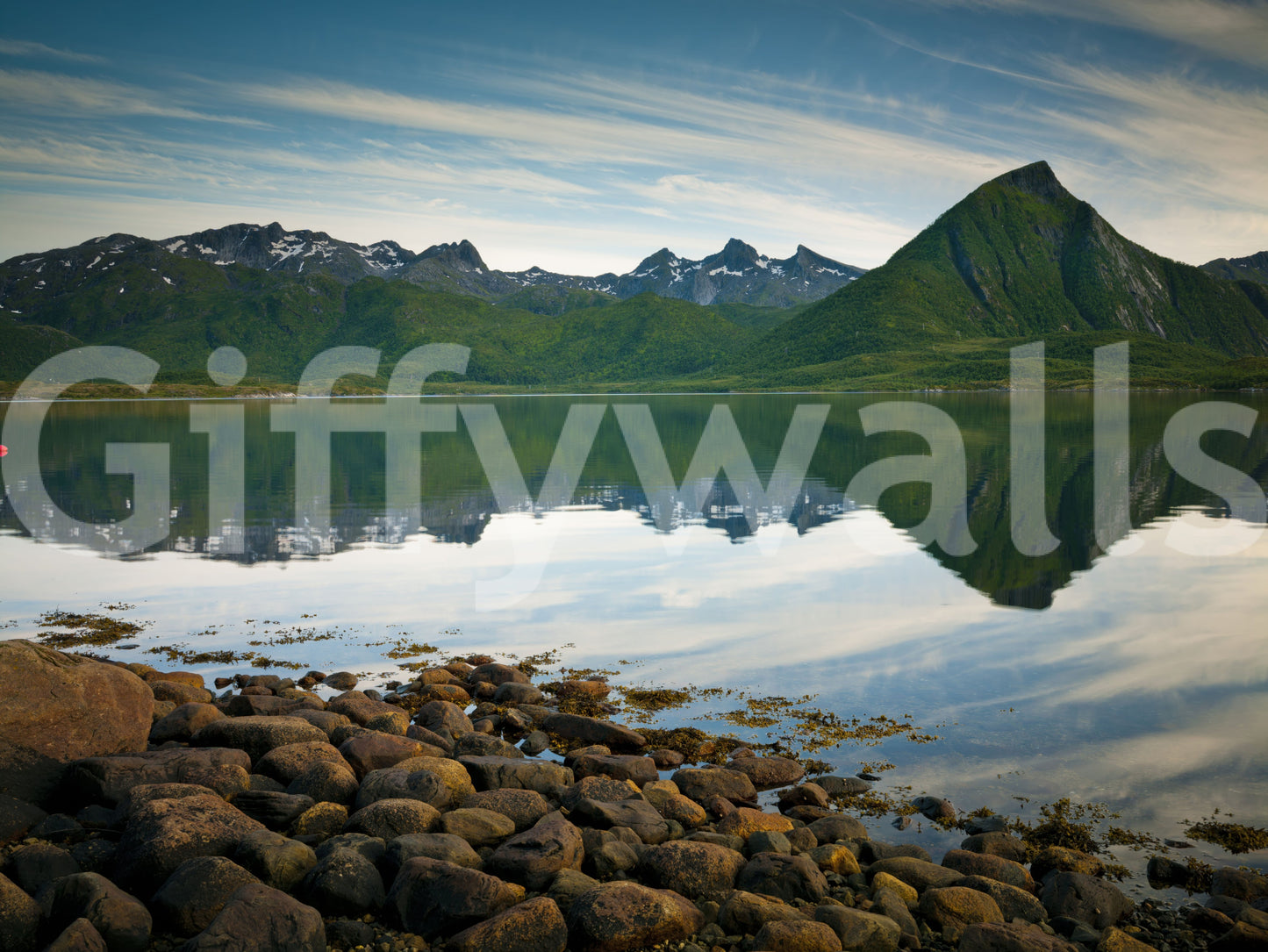 Cool greens and slate blues mingle on this emerald peaks mirror waters wall mural.