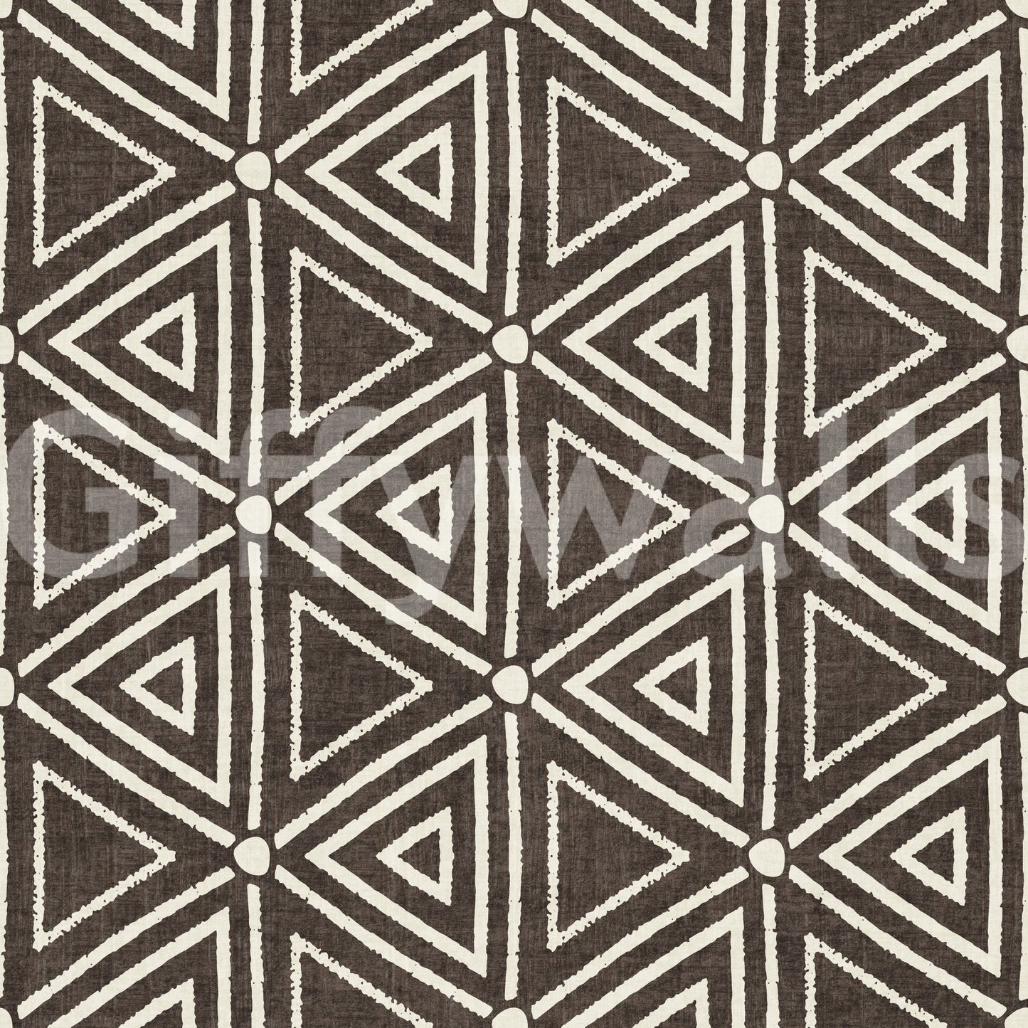 Mudcloth-style nested triangles laid on umber wallpaper in cream and brown