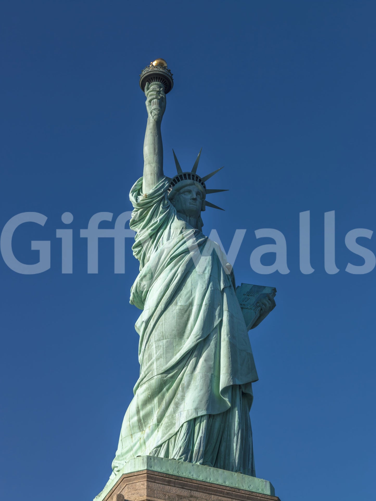 Full statue view of Liberty's Azure Grace wall mural against azure