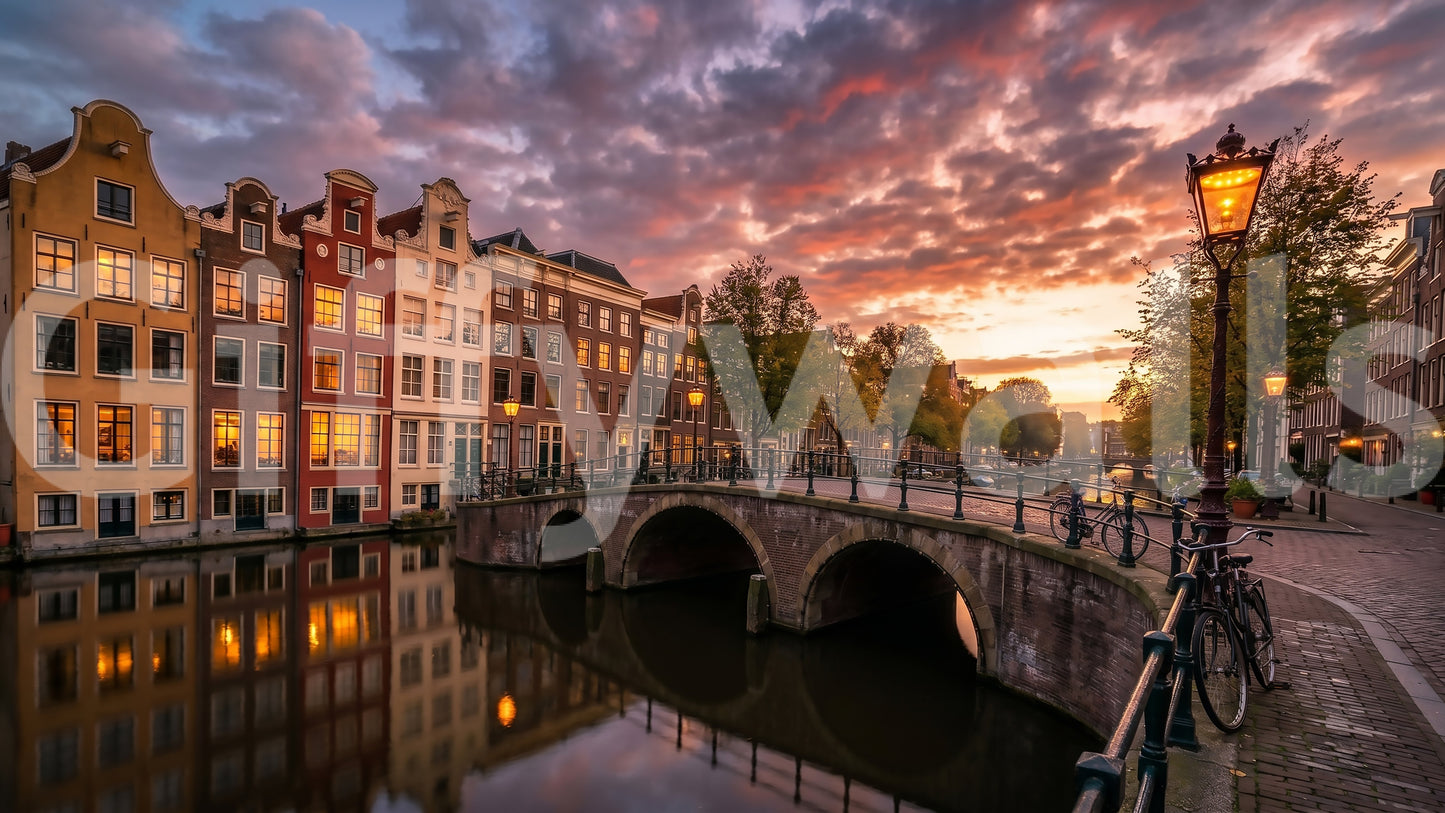 Traditional Amsterdam architecture wall mural with golden sky and pink clouds.