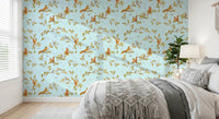 Bedroom with blue oak branch wallpaper and delicate squirrels and mice