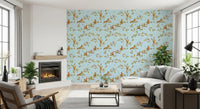Bright living room with blue chinoiserie wallpaper and woodland squirrel motifs