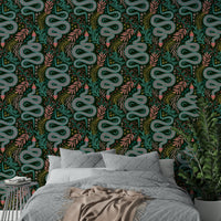 Vibrant patterned snakes in forest setting

