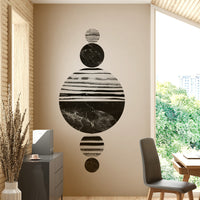 Black and white marble circles arranged vertically in a symmetrical formation.

