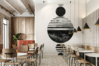 Minimalist modern wall art with stacked marble and striped circles in grayscale.

