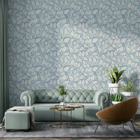 Blue wallpaper with floral leaf accents


