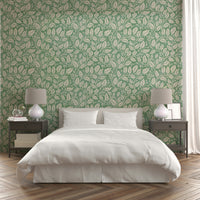 Green wallpaper featuring intricate leaf branches

