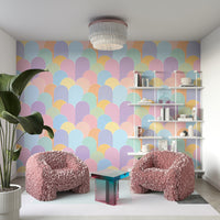 Playroom with bright pastel rainbows mural

