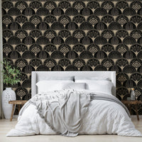 Black wallpaper with metallic gold fan design

