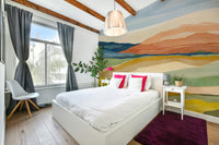 Living room accent with natural sunset wallpaper

