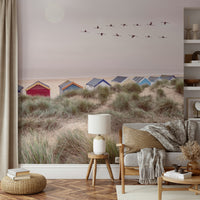 Beach view wall mural with gentle waves and golden sand

