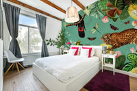 Jungle birds flying above a dense tropical forest.

