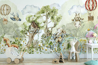 Playful woodland theme mural with animals and trees.

