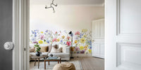 Wall mural featuring delicate watercolor wildflowers in a meadow

