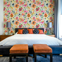 Bold psychedelic poppies floral wallpaper in warm orange hues

