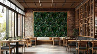 Emerald eyes peering from the jungle leaves wallpaper design.

