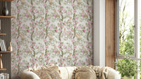 Pink floral wallpaper with perched birds


