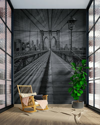 Iconic bridge mural featuring detailed Brooklyn Bridge arches.

