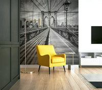 Black-and-white mural of Brooklyn Bridge and Manhattan skyline.

