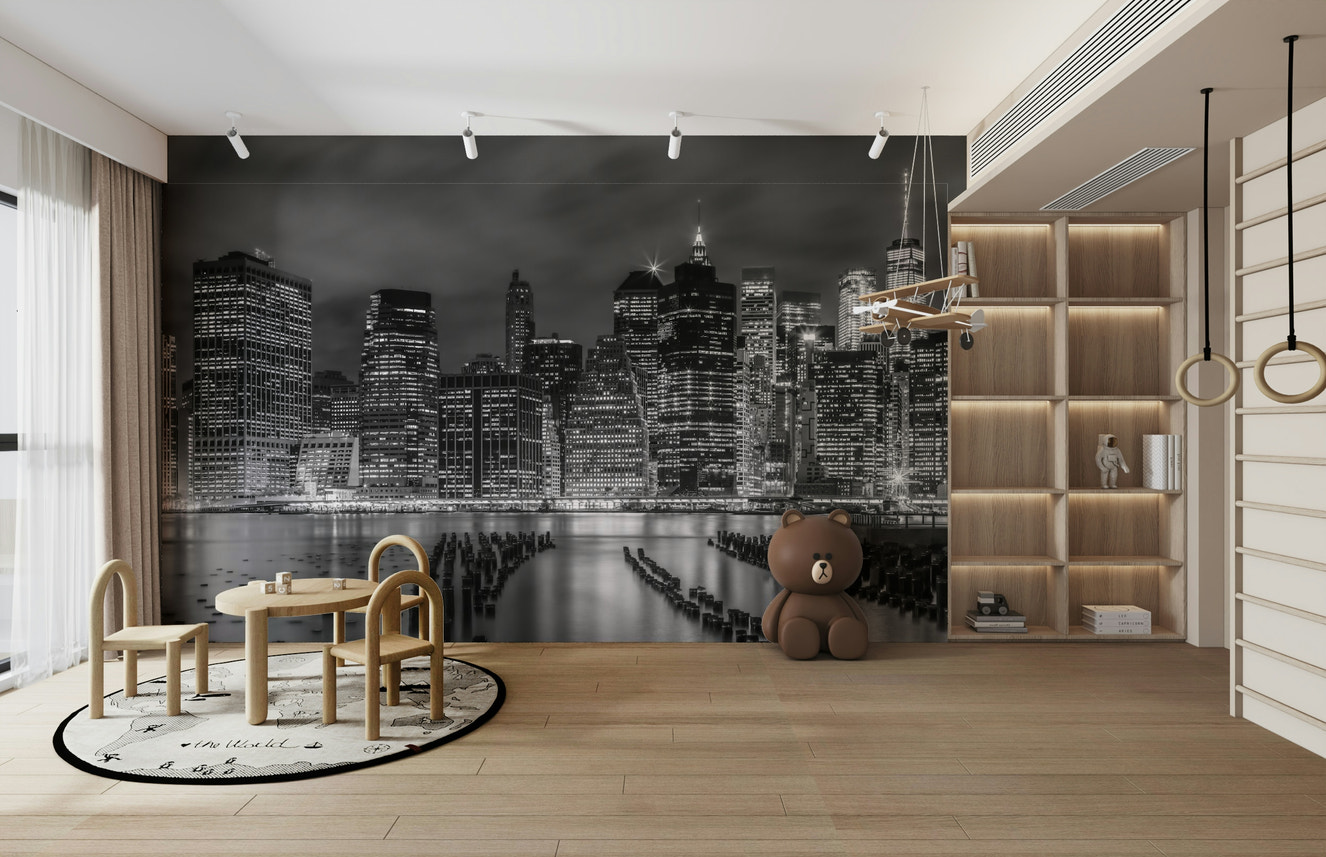 Monochrome wall mural of New York City skyline at night.

