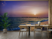 Artistic beach mural with warm sunset tones and calm sea.

