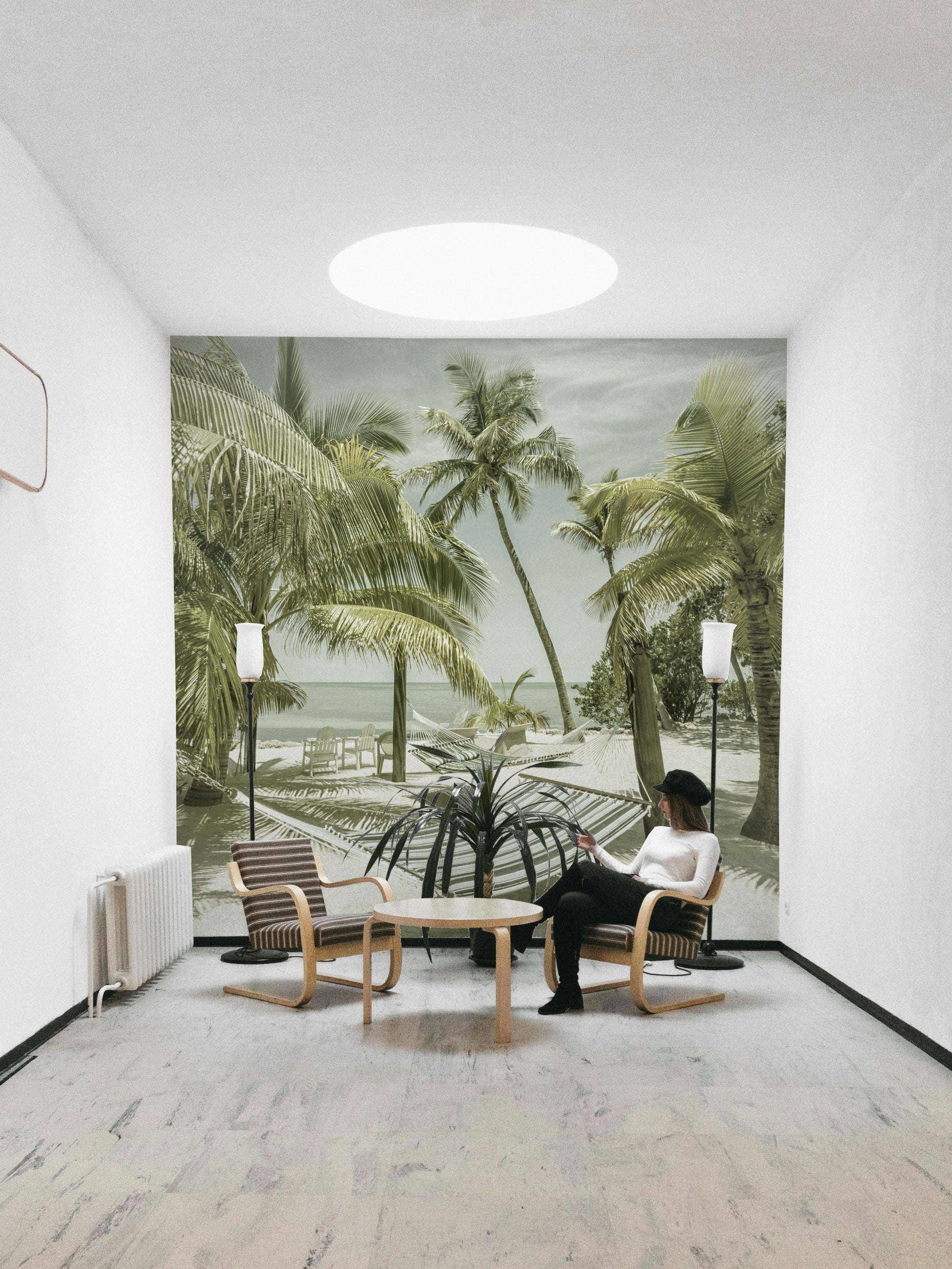 Retro-style mural featuring sunlit skies and sandy shores.

