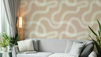Beige wallpaper with natural flow and meditative pattern.

