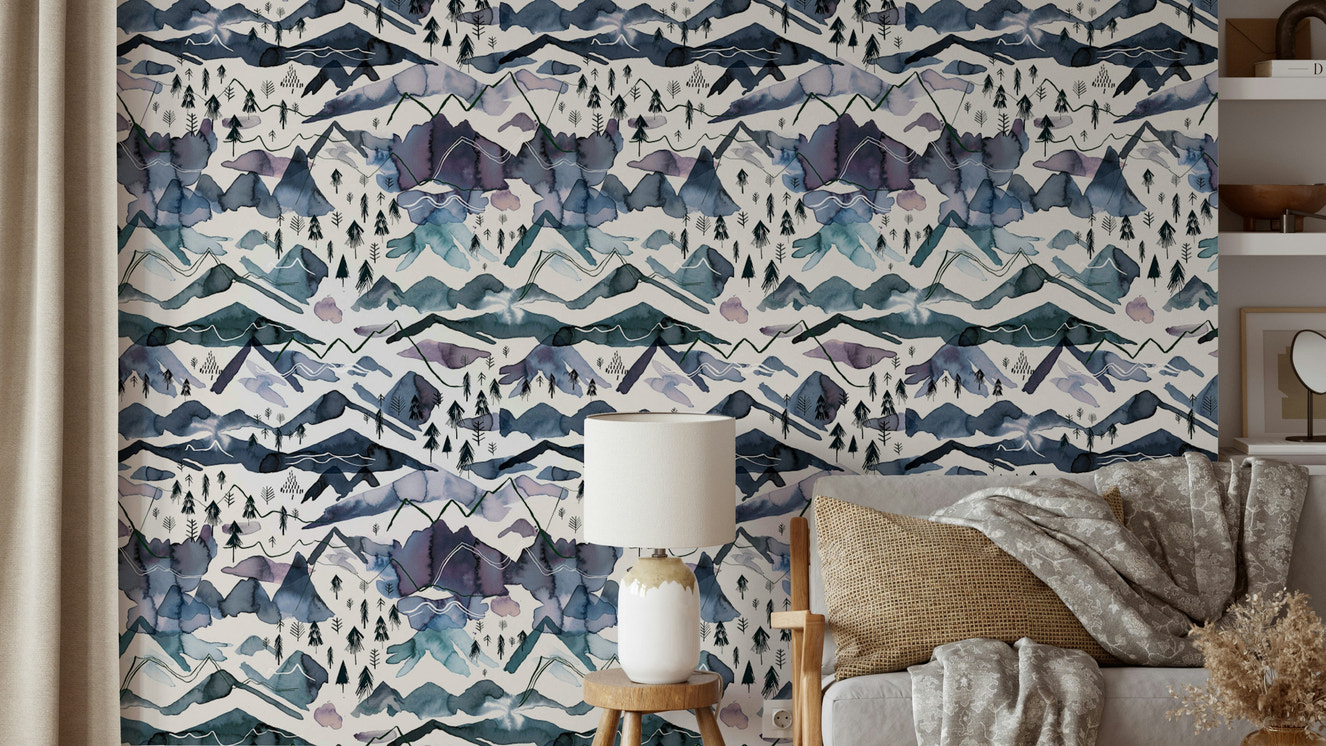 Dreamy watercolor mountain wallpaper in blue and mauve tones.


