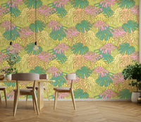 Avocado green wallpaper featuring pastel monstera leaves

