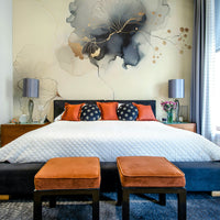 Golden foliage mural on a soft neutral background.

