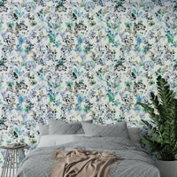 Nature-inspired wallpaper in cool blue with grass motifs.

