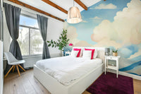 Whimsical cloud mural for tranquil home decor

