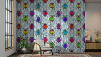 Blue wallpaper with rainbow-colored bugs in playful patterns.


