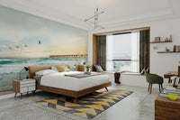 Coastal wall mural with soft sunset over calm waters

