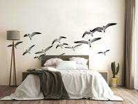 Soothing mural of birds flying in formation

