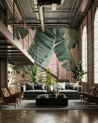 Bold mural design with banana leaves and pink hues

