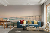Serene sunset pier wall mural with warm tones

