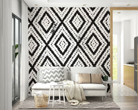 Mosaic-style wall art in shades of gray and white

