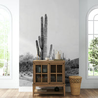 Bold desert cactus silhouette on a monochrome background.


