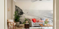 Serene California coast mural with black and white tones.

