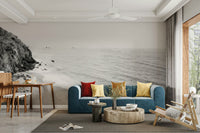 BW California coastline mural with crashing ocean waves.

