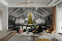 Bold mural of descending subway escalator

