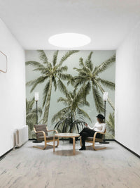 Relaxing room with lovely palm tree wall design

